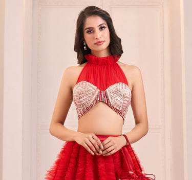 Red Embroidered Halter Neck Mashru Blouse with Ruffle Lehenga and Potli Bag