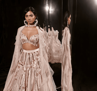 Nude Embroidered Lehenga Set With Ruffle Cape