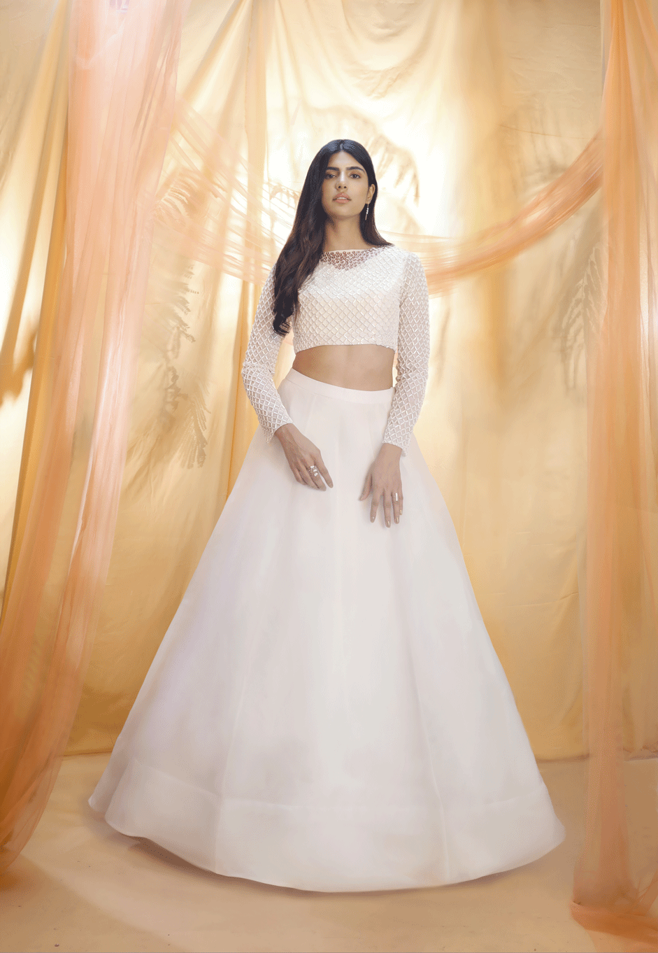 Off White Lehenga With An Embroidered Blouse